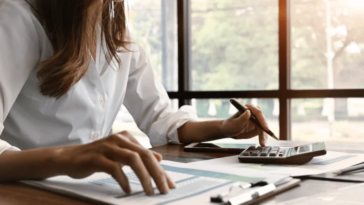 Business person calculating taxes