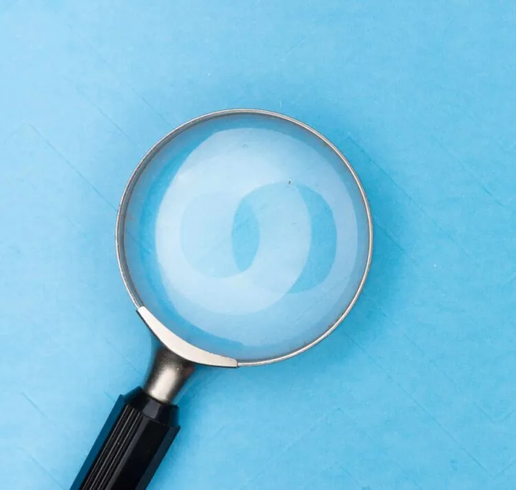 magnifying glass on blue background