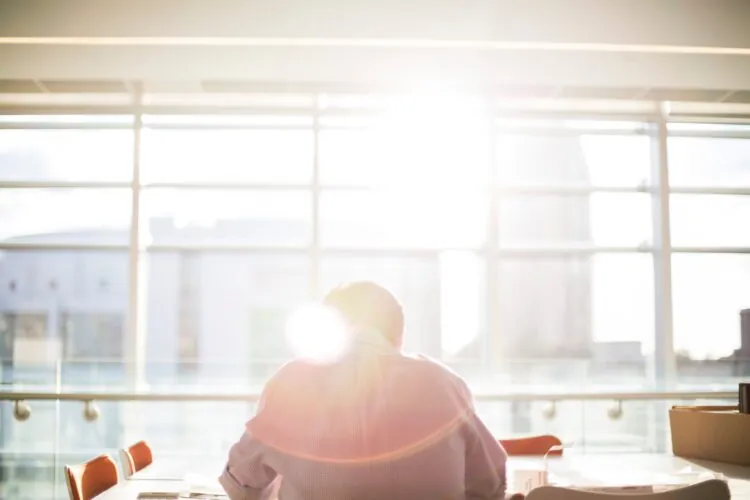 Office worker near window