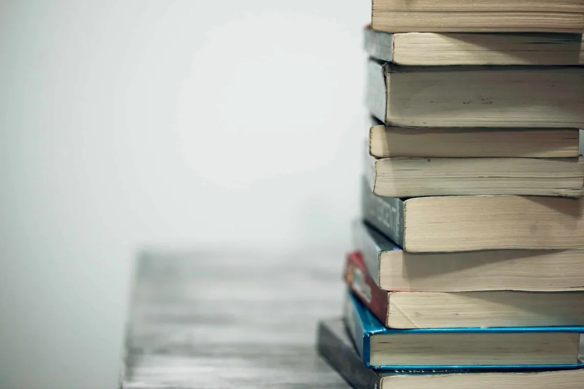 a stack of books on a desk