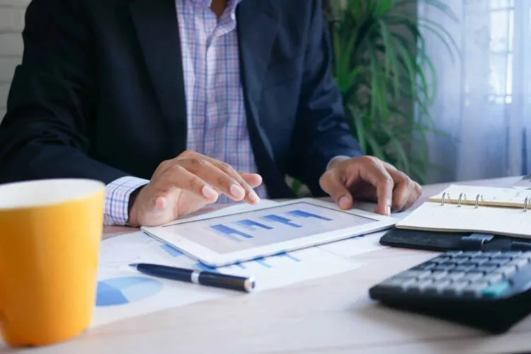 corporate businessman looking at financial figures