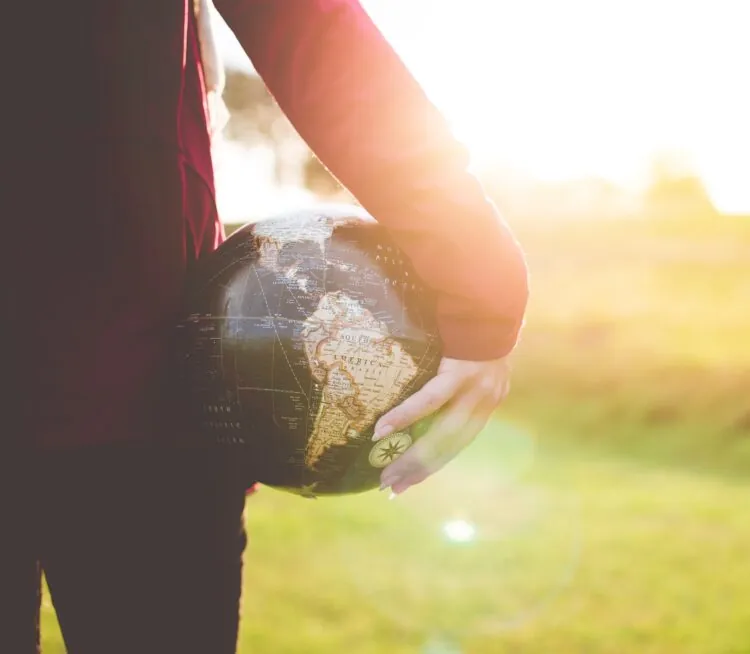 Woman Holding Globe