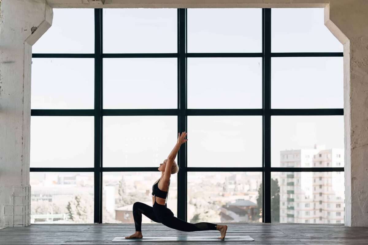 a woman doing yoga in a yoga studio