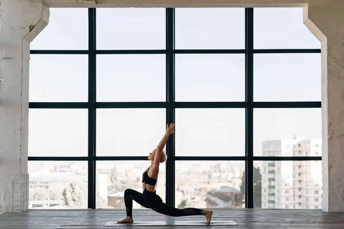 a woman doing yoga in a yoga studio