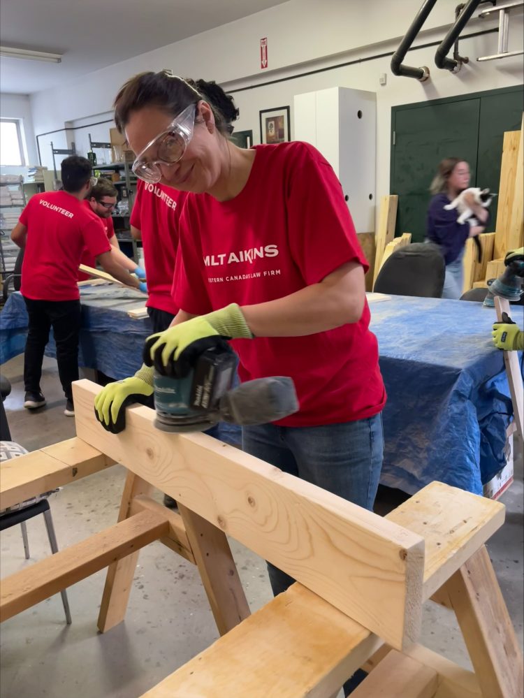 MLT Aikins team volunteering on community outreach day