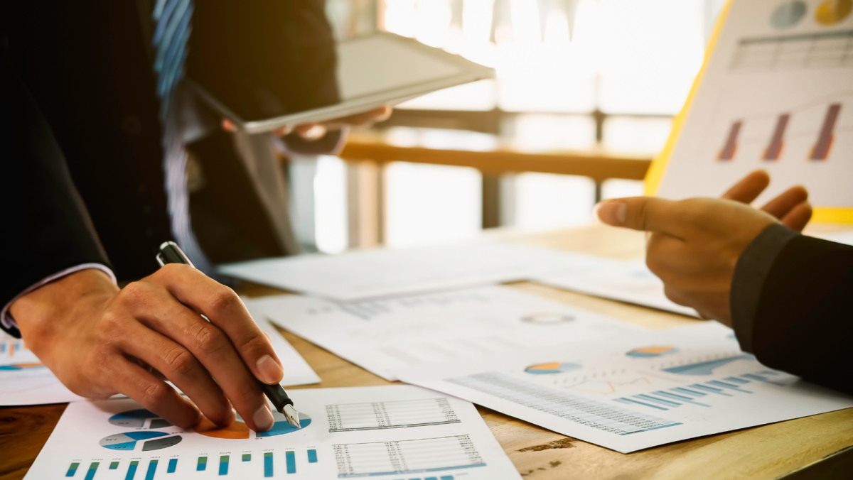 Business people look at reports