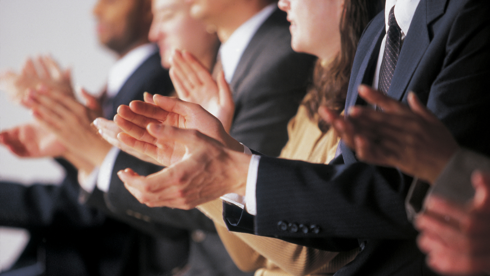 business people clapping