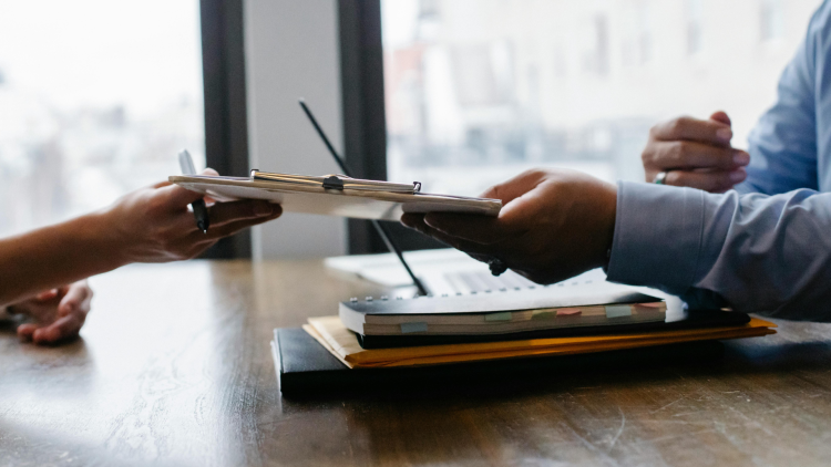 HR meeting, passing a contract document