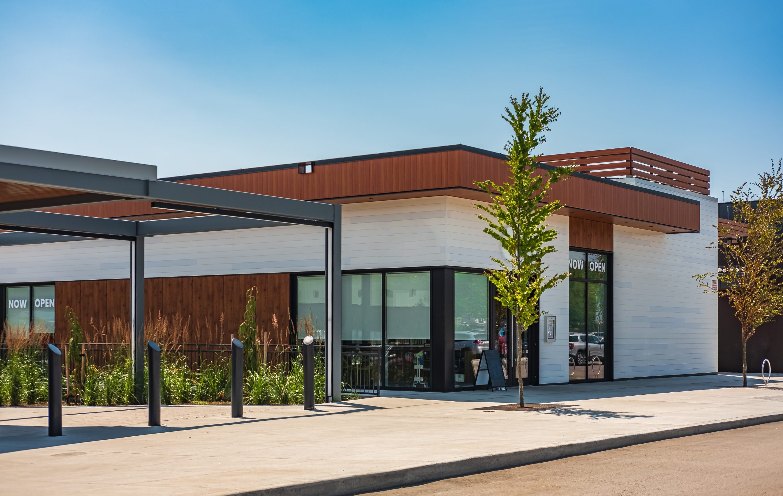 Commercial retail space with "now open" sign