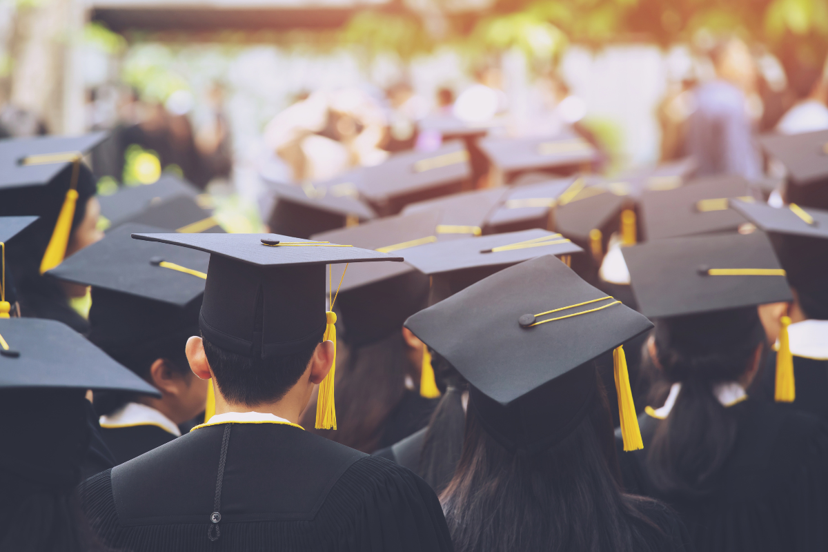Group of graduates wearing caps and gowns at convocation ceremony