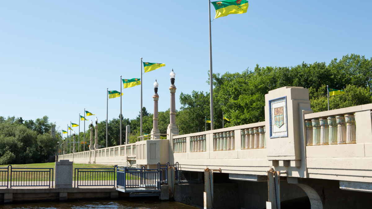 A row of Saskatchewan flags line the Albert Memorial Bridge in Regina