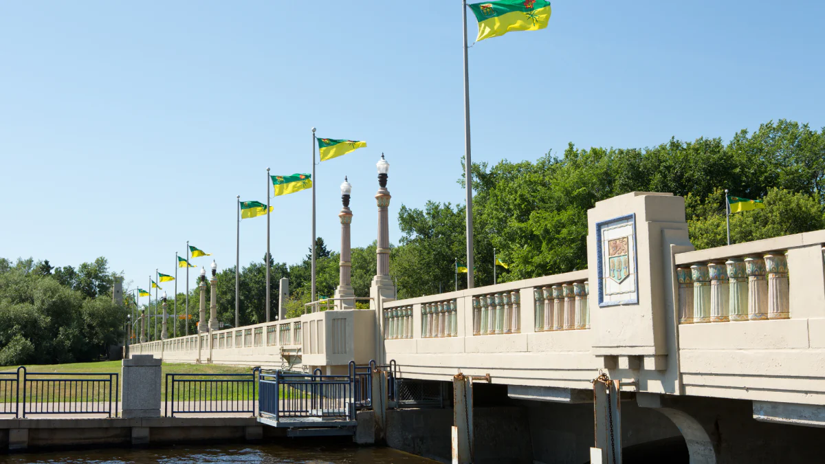 A row of Saskatchewan flags line the Albert Memorial Bridge in Regina