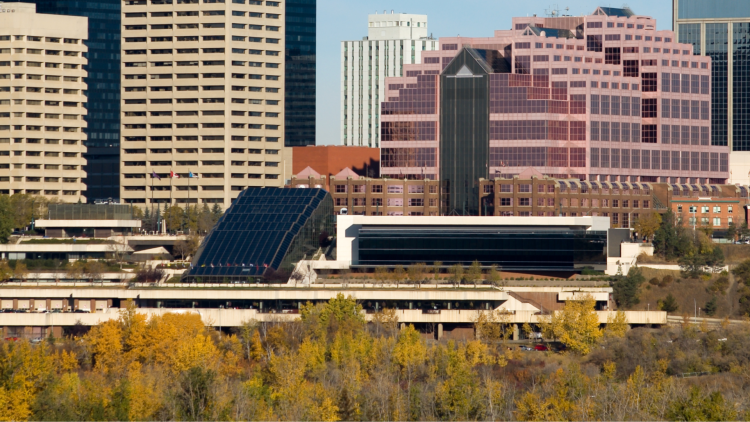 A landscape photo of the Edmonton skyline in the fall, the focal point being the Edmonton Convention Centre