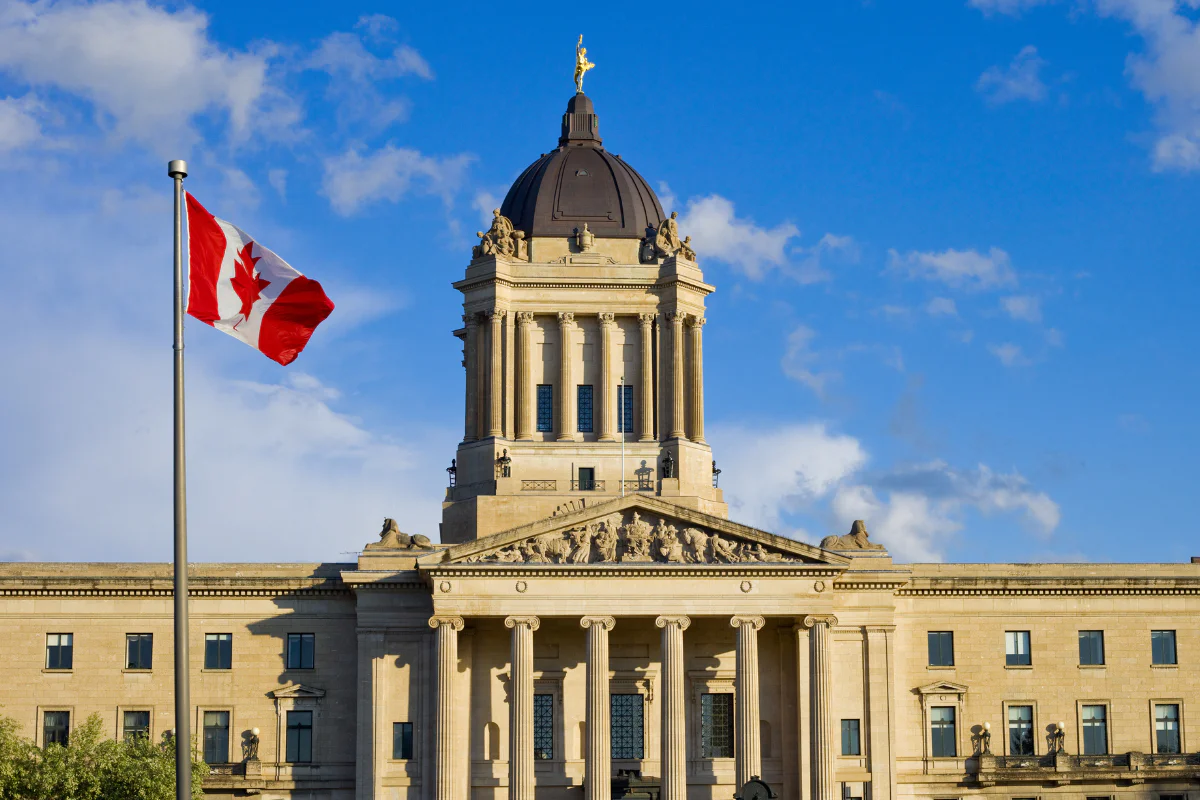 Canadian flag in front of Manitoba legislative building