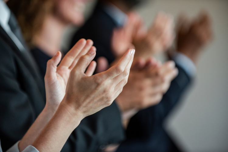 Business people clapping