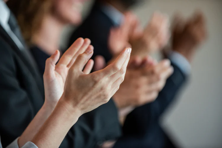 Business people clapping