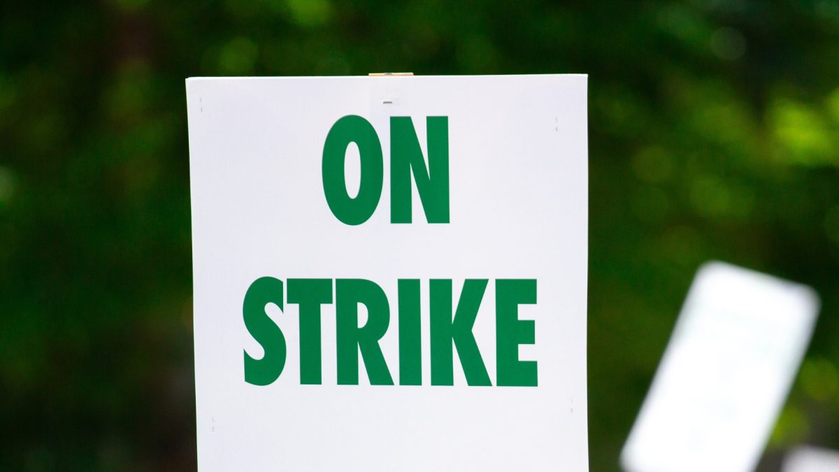 Picket sign with "On strike" written on it.