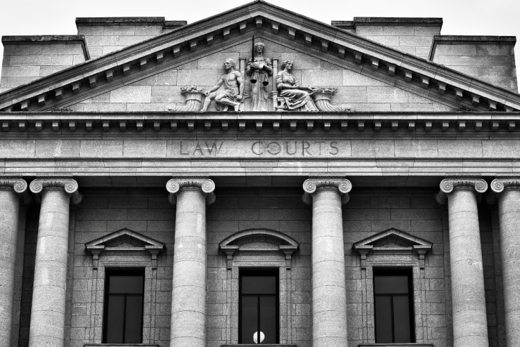 A black and white photo of a court building