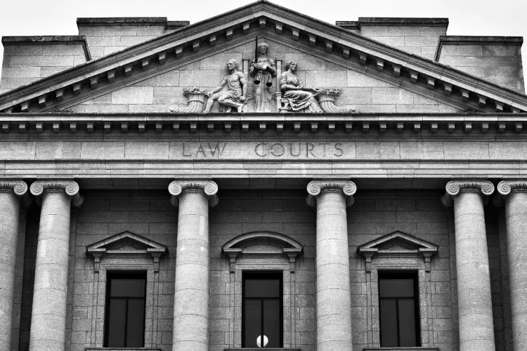 A black and white photo of a court building