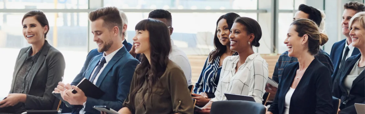 Group of smiling HR professionals at a seminar