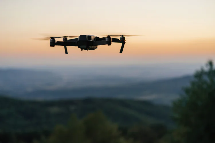 drone flying at dusk