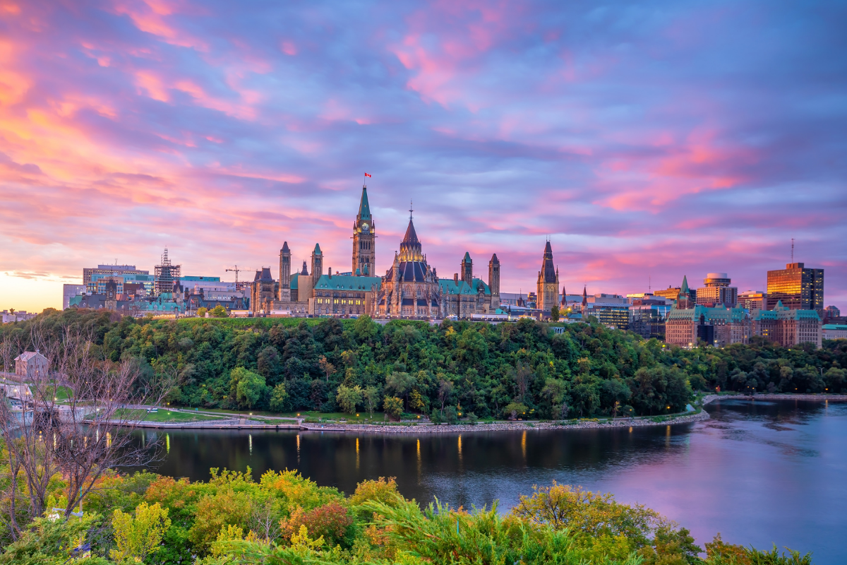 Parliament Hill in Ottawa at sunset with early fall foliage