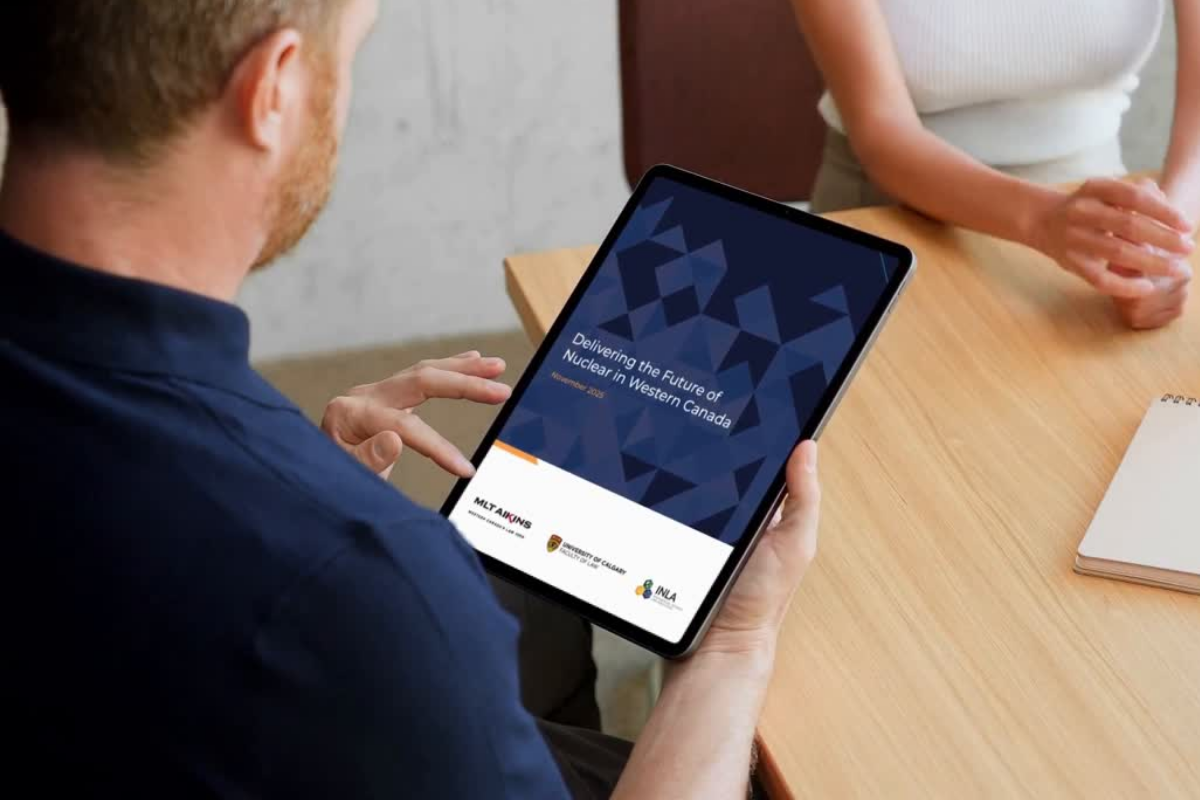 Person views "Delivering the Future of Nuclear in Western Canada" report on a tablet
