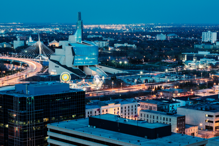 The Winnipeg skyline in the evening overlooking the Forks and the Museum of Human Rights