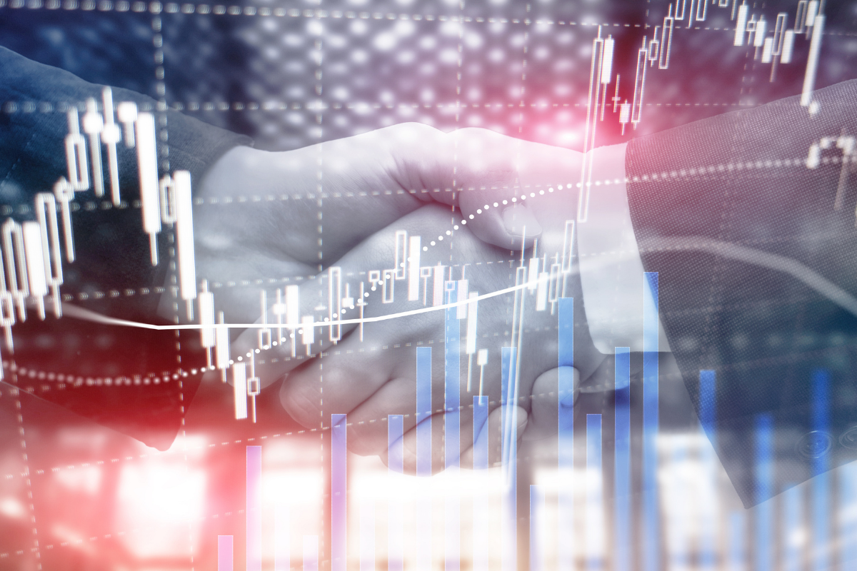 Hands shaking over a graphic of a graph going up over time