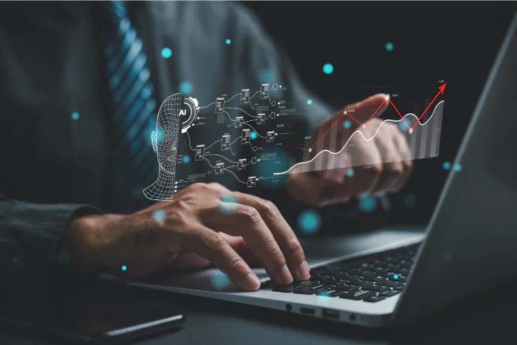 Someone typing on a laptop in a dark room with futurist ai graphics overlaid above their hands