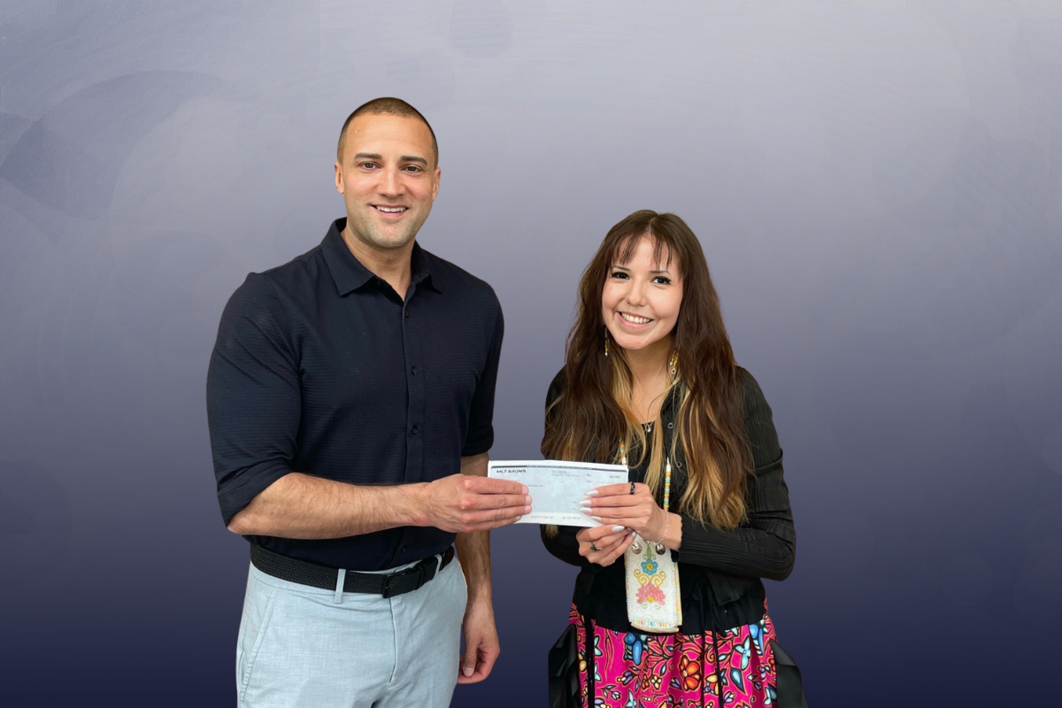 Drew Lafond presents cheque to Sean Grey