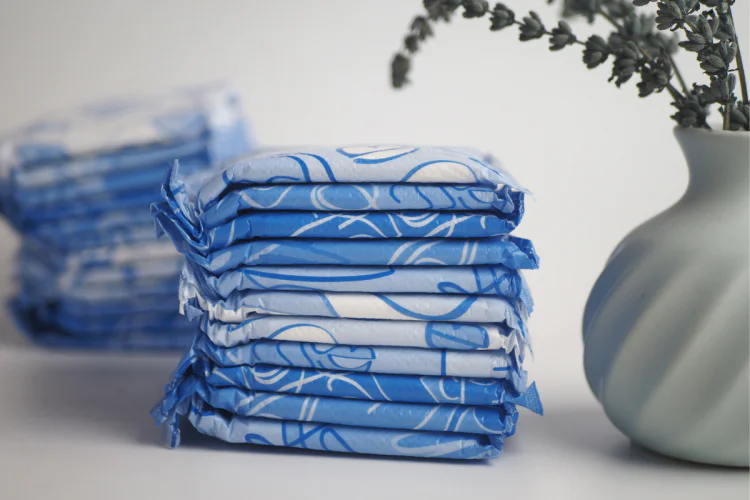A stack of menstrual pads on a white table