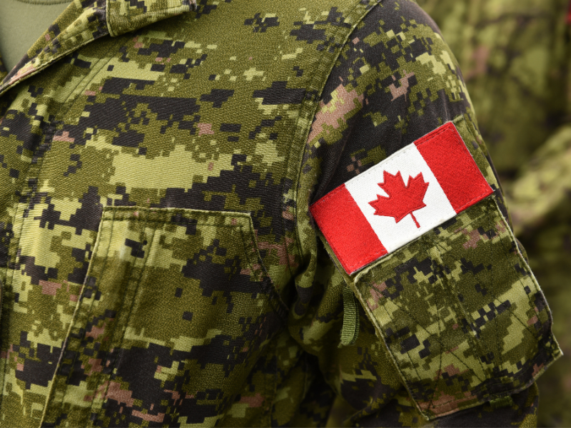 A close-up of someone in a Canadian military uniform