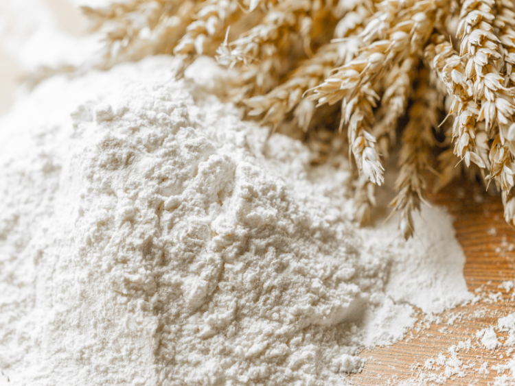 Wheat and flour on a table