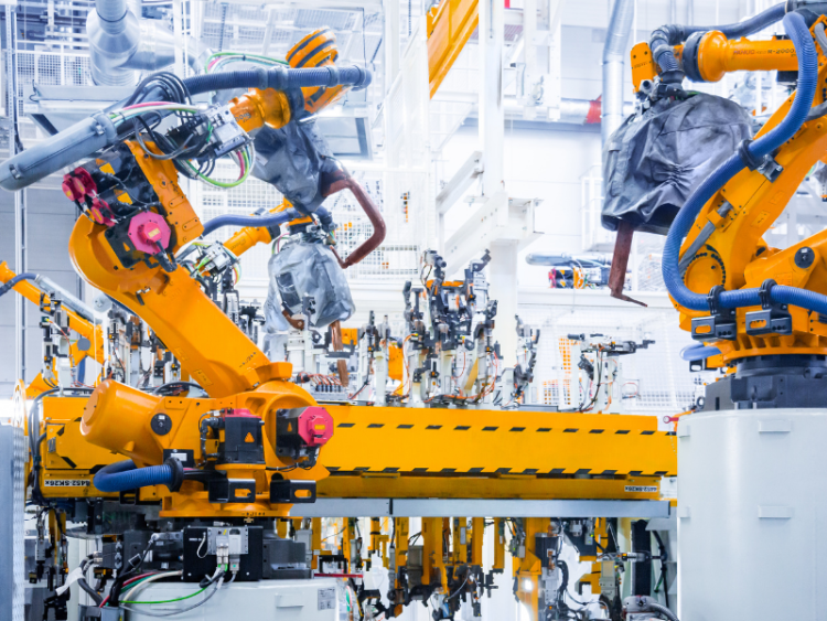 Robotic arms in a car manufacturing facility