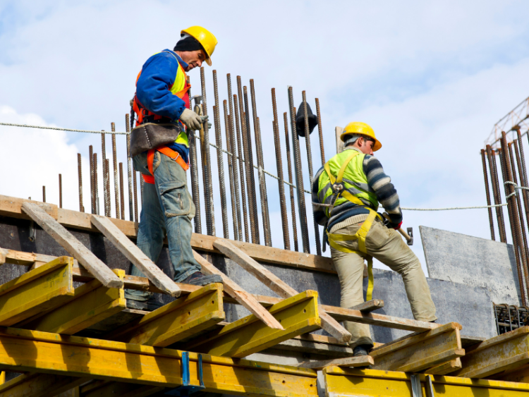 Two construction workers on a jobsite