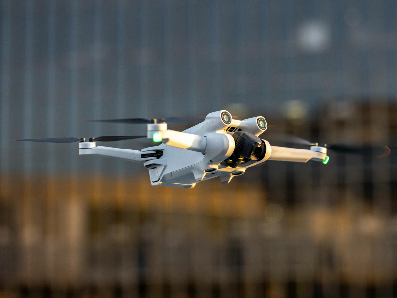 A drone in flight against an urban background